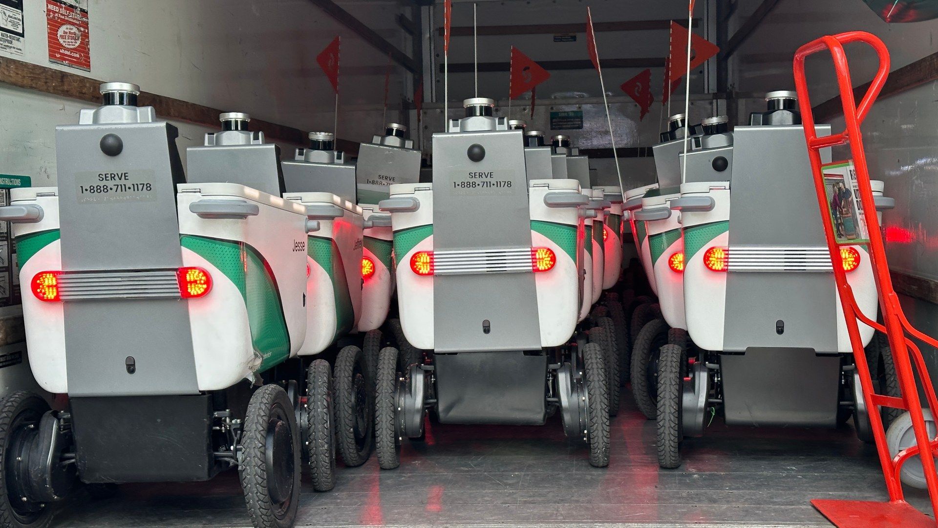 Serve Robotics delivery robots lined up inside a truck in Miami